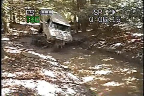 1989 Ford Bronco - An off-road vehicle navigates a muddy trail, with a timestamp indicating 6 minutes and 15 seconds into a recording.