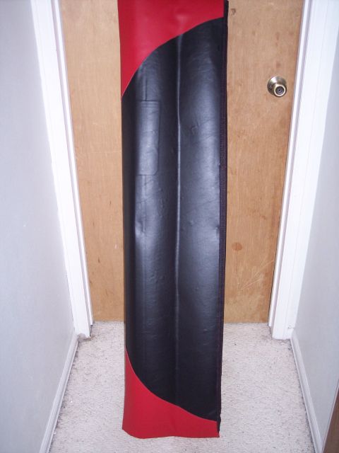 1972 Ford Ranchero - A two-tone car floor mat is shown standing upright indoors.