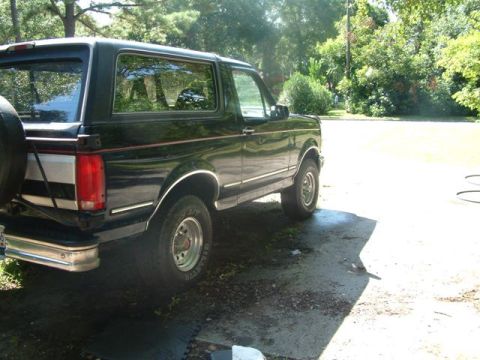 1992 Ford Bronco - This 1992 Ford Bronco is shown from the rear three-quarter angle, parked outdoors.