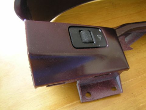 1993 Ford Probe - Close-up of a car's interior trim piece with a rotary dial and light symbol, likely a part for sale.