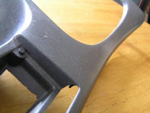 1993 Ford Probe - Close-up of a gray textured interior trim piece, likely a dashboard or console component.