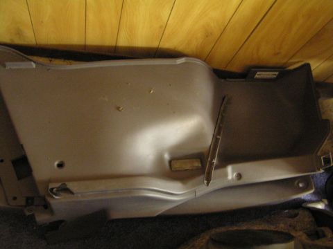 1993 Ford Probe - A gray plastic interior trim panel is shown, likely from a car's interior.
