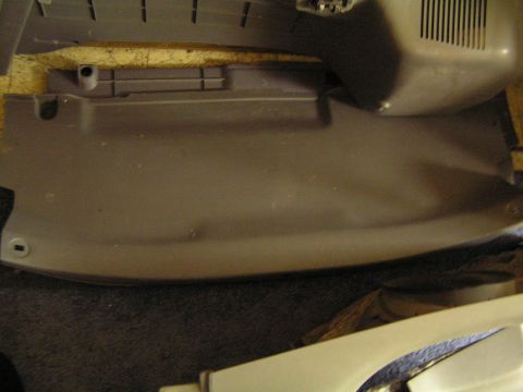 1993 Ford Probe - Interior dashboard panel with a vent and a noticeable dent.