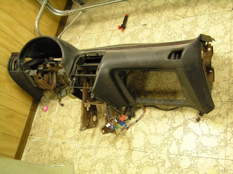 1993 Ford Probe - This is a dashboard assembly, likely for a car, with its wiring harness exposed. The registry claims it is from a 1993 Ford Probe, but this…