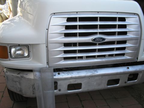 1999 Ford F-800 - prep for bug screen...install just behind grill. Ford made it easy as its attached by 10? phillips head screws.