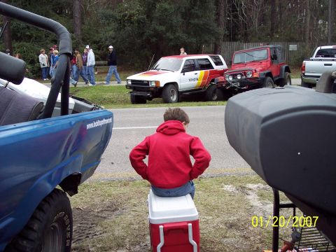 1984 Toyota 4Runner - Two off-road vehicles, a 1984 Toyota 4Runner and a Jeep Wrangler, are parked side-by-side.