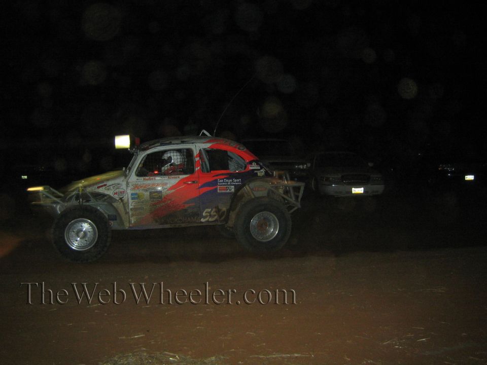 Class 5 Baja Bug race buggy at night with red and blue paint, number 55