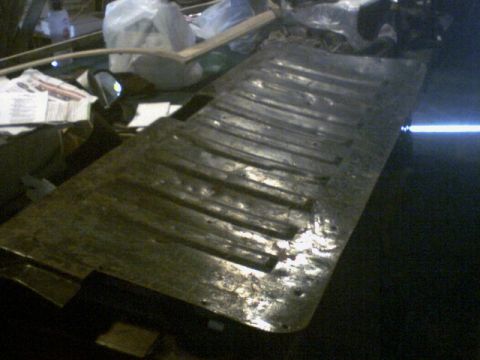 1973 Ford Ranchero - This appears to be a section of corrugated metal, likely a part from a vehicle's undercarriage or bed, not a complete vehicle.