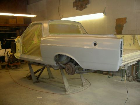 1967 Ford Ranchero - 1967 Ford Ranchero in primer, undergoing repairs in a workshop.