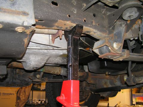2000 Ford Excursion - Since we'll need to jack the truck up and lower the front end, I jacked the front end under the axle tube as high as my floor jack would go…