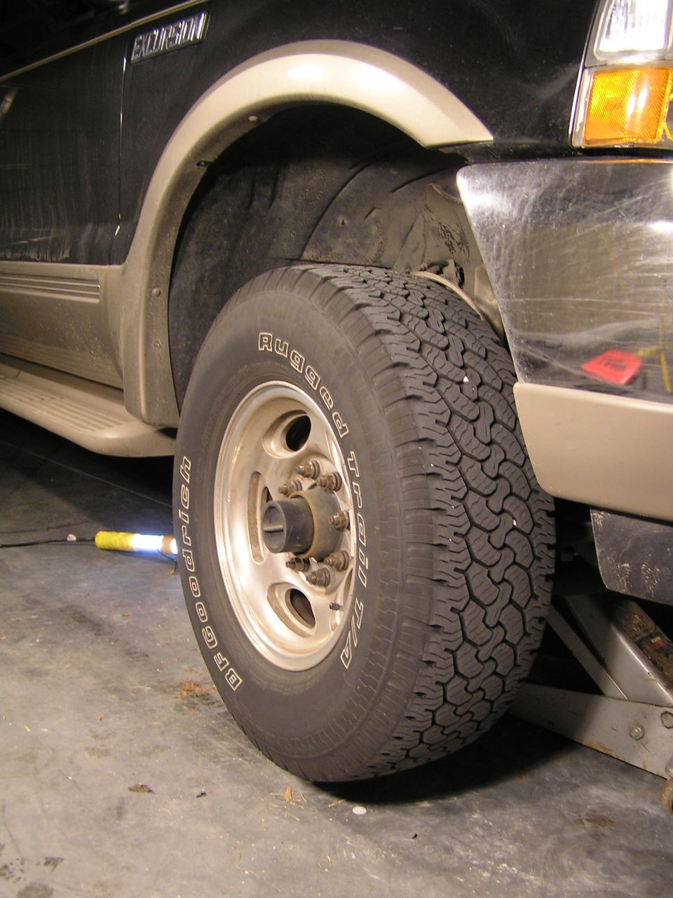 With the vehicle secured on jack stands and your floor jack still maxed out under the front axle, now it's time to remove the wheel.

[b]Tools needed:[/b]
21mm deep socket
1/2" impact wrench