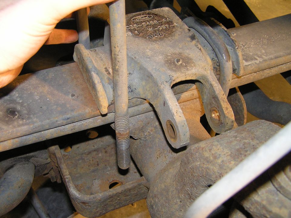 Slide the u-bolts out from the top. They pull out quite easily.