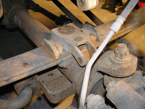 2000 Ford Excursion - All 4 u-bolts removed. Notice the round mark on the bump-stop from the rubber stopper. This is from constant bottoming-out of the suspensio…
