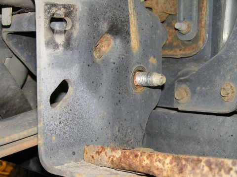2000 Ford Excursion - Success! Before you go pounding this bolt out, you'll need to remove a support bracket on the front of the radiator for the trans cooler. P…
