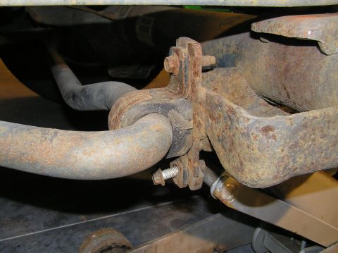 2000 Ford Excursion - Before we drop the front axle, we must disconnect the way bar. If we don't, the sway bar will prevent the front axle from dropping all the…