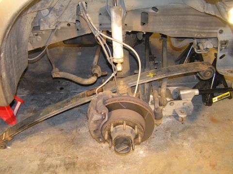 2000 Ford Excursion - The coast is finally clear to remove the leaf spring. You can use your 3-lb hammer to knock it out of the spring hangers. The leaf spring i…