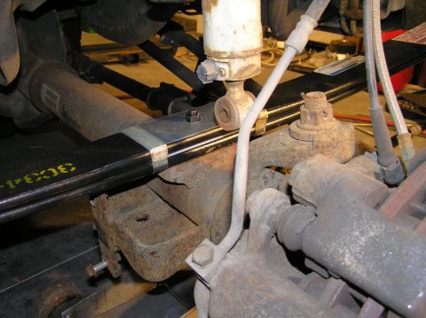 2000 Ford Excursion - Jack the front axle back up with your floor jack. Hopefully the stud in the new leaf spring will align with the notch on the leaf spring pe…
