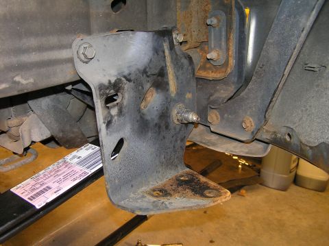 2000 Ford Excursion - Reinsert the eye bolt in the front of the leaf spring first (save the rear bolt for the next step for easier installation). The front sprin…