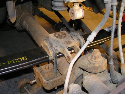 2000 Ford Excursion - Reinstall the u-bolts and tighten with the new nuts (discard the old nuts). Hand-tighten at first, ensuring each nut is threaded evenly, th…