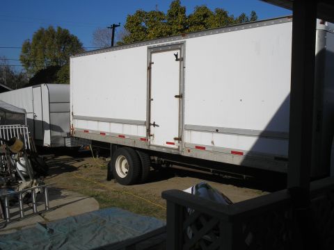 1999 Ford F-800 - poor shot showing it hooked up the the 24' box trailer. had lots to move to get both to fit in the back yard.
