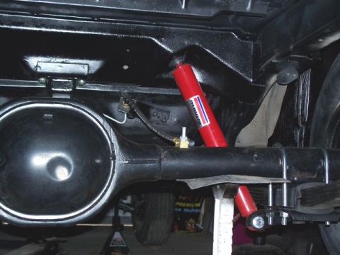 1971 Ford Ranchero - Close-up of the vehicle's rear axle and suspension system, showing new shock absorbers installed.