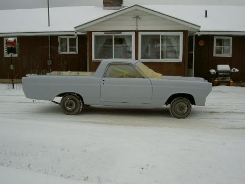 1967 Ford Ranchero - This vehicle appears to be a 1967 Ford Ranchero, currently in primer and covered in snow.