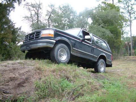 1992 Ford Bronco - This 1992 Ford Bronco is shown navigating a dirt hill off-road.