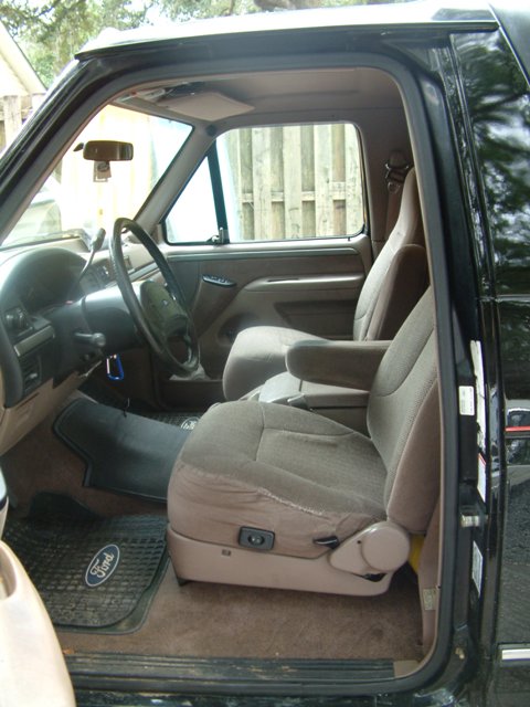 1992 Ford Bronco - Interior view of a 1992 Ford Bronco, highlighting the front seating area and dashboard details.