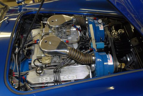 1979 Ford Bronco - Close-up of a powerful engine with "COBRA 427" inscribed on the valve covers.