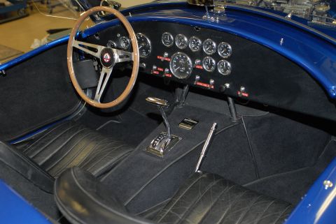 1979 Ford Bronco - Interior view of a classic car, a dashboard with numerous gauges and a central shifter.