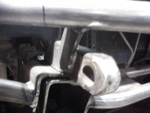 1995 Ford Bronco - This photo shows a close-up view of a custom-fabricated metal bracket with visible welds.