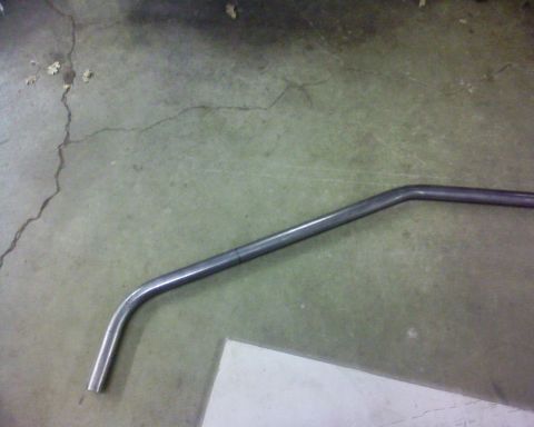 1995 Ford Bronco - A bent metal pipe is shown on a concrete floor.
