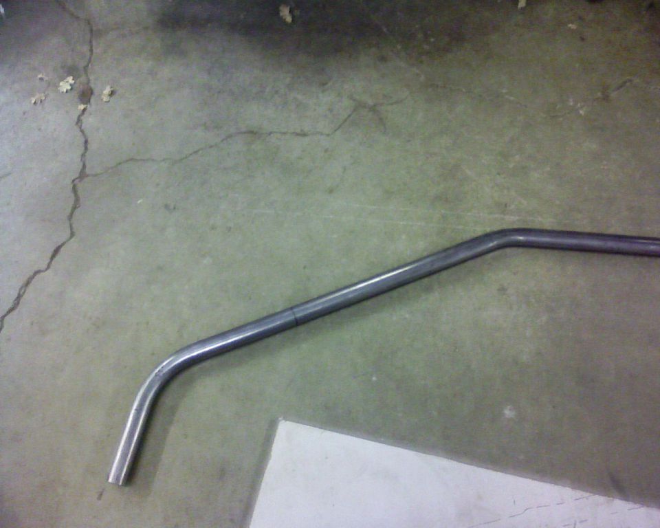 Bent metal pipe on concrete floor