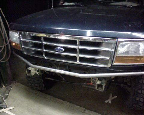 1995 Ford Bronco - Front view of a 1995 Ford Bronco showing the grille and a custom bumper.