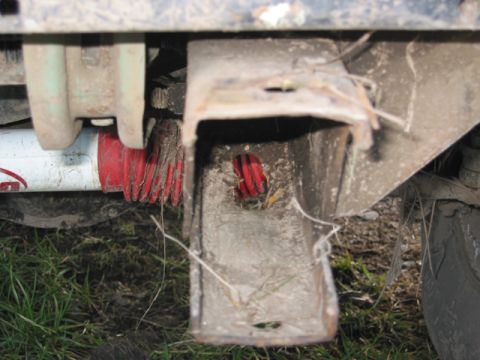 1968 Ford Bronco - Detail of a vehicle's undercarriage, showing suspension parts and frame.