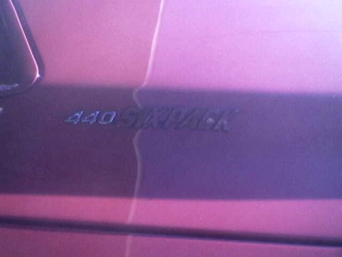 1988 Ford Bronco - A "440 SIX PACK" emblem is visible on the side of a vehicle.