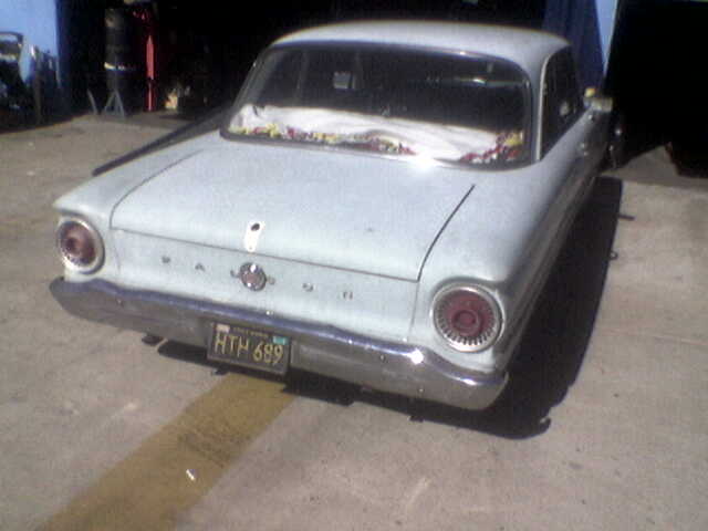 Pale blue 1963 sedan rear view, license plate HTM 689