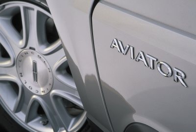 2003 Lincoln Aviator - The 'AVIATOR' badge is clearly visible on the side of this Lincoln vehicle, next to its wheel.