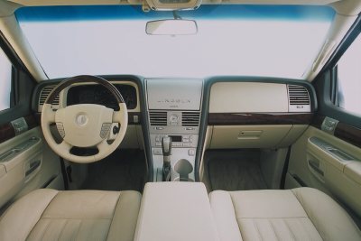 2003 Lincoln Aviator - The interior of a 2003 Lincoln Aviator features tan leather seats and wood accents.