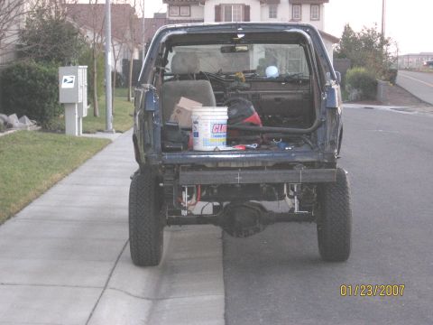 1994 Ford Bronco - This SUV has a custom rear bumper and its tailgate has been removed, revealing the interior cargo area.