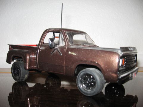 1977 Ford F-150 - Model pickup truck with a brown metallic finish and black wheels is shown from a 3/4 front angle.
