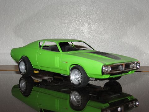 1977 Ford F-150 - This is a model of a green car with a black stripe on the hood, shown from a 3/4 front angle.