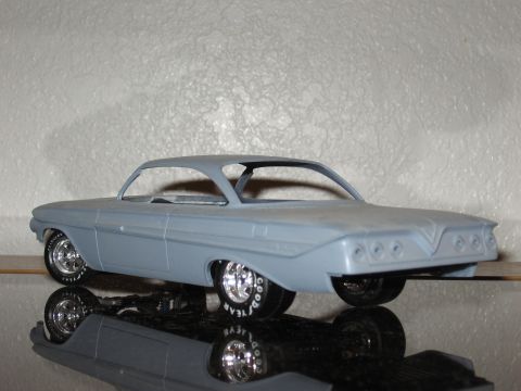 1977 Ford F-150 - This model car, likely a 1961 Chevrolet Impala, is shown in a 3/4 front view with custom wheels and tires.
