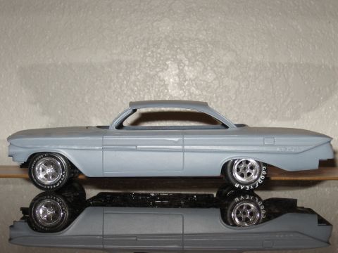 1977 Ford F-150 - Model car with custom wheels and tires sits on a reflective surface.
