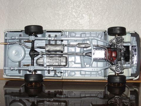 1977 Ford F-150 - This image shows the detailed underside of a model truck, highlighting its chassis, drivetrain, and exhaust components.