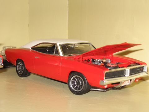 1977 Ford F-150 - Model car of a 1969 Dodge Charger, red with a white roof, hood open.