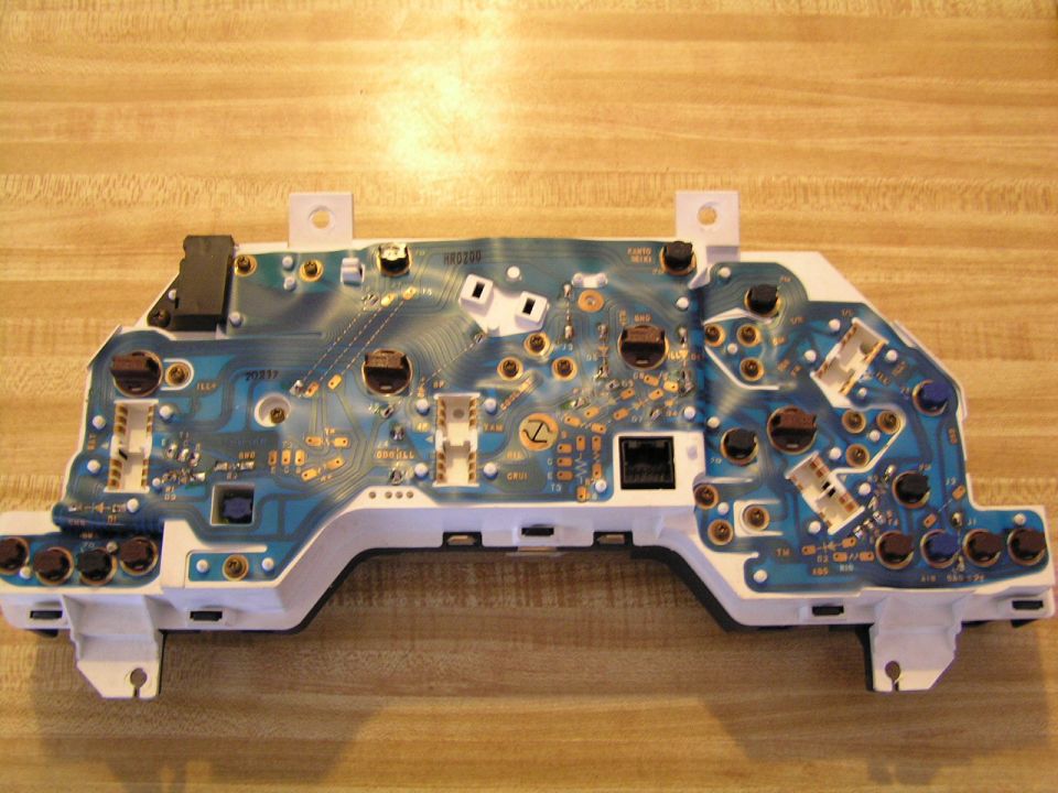 Instrument cluster circuit board with blue PCB and various electronic components