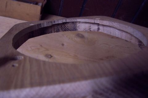 1990 Ford Bronco - A wooden part, likely a speaker adapter, is shown with visible wood grain and cut marks.