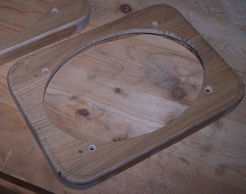 Wooden speaker adapter with oval cutout and mounting holes