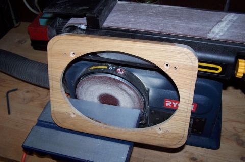 1990 Ford Bronco - Wooden speaker adapter frame and Ryobi disc sander. The frame has mounting holes for installation.